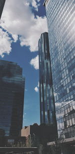 Low angle view of modern buildings against sky