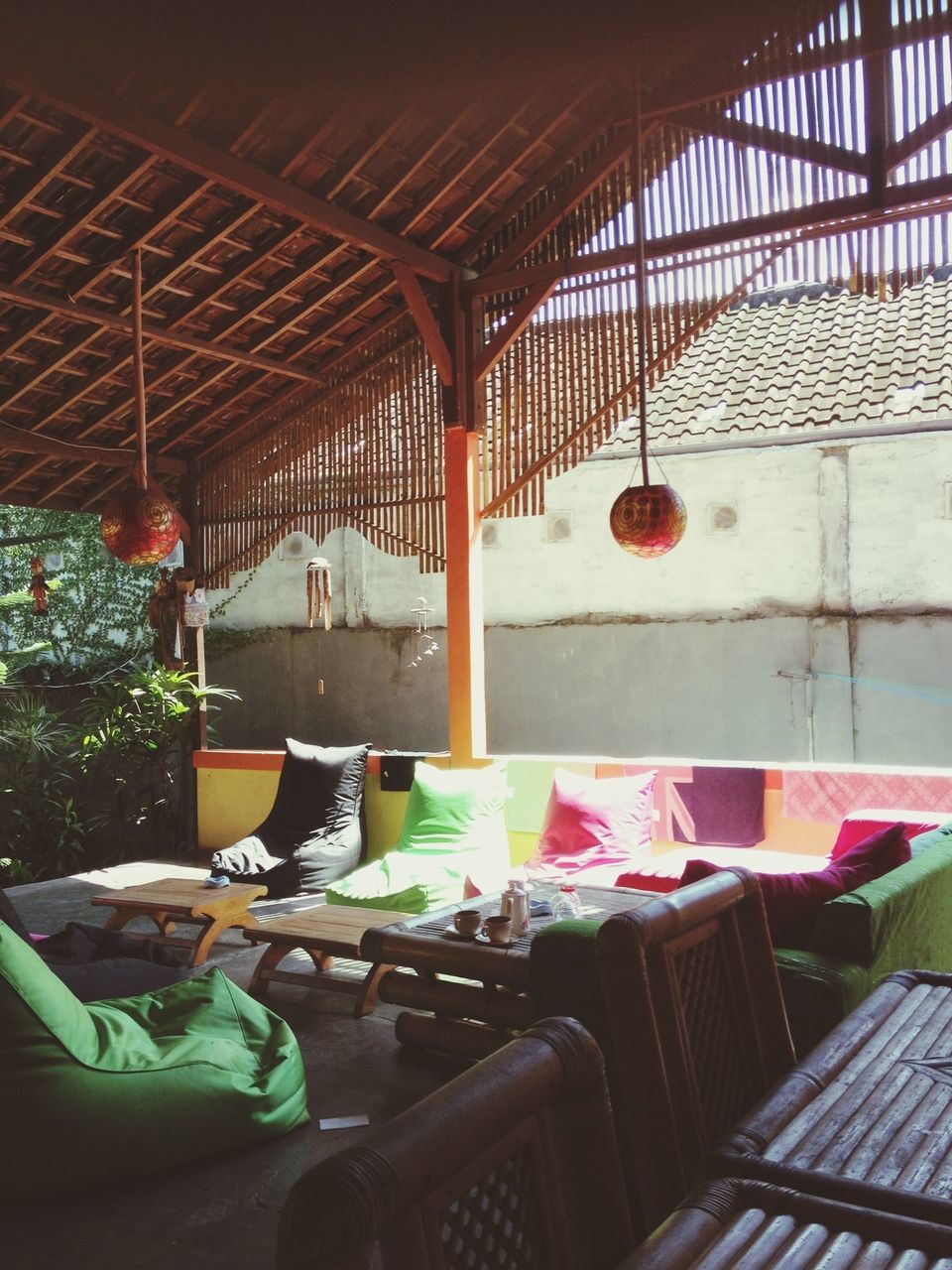 indoors, architecture, chair, table, built structure, window, potted plant, absence, empty, house, glass - material, day, home interior, ceiling, no people, plant, furniture, restaurant, sunlight, high angle view