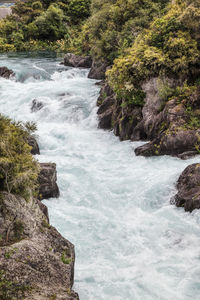 Stream flowing through rocks in sea