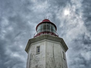 Low angle view of building against cloudy sky