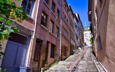 Narrow alley amidst buildings in city