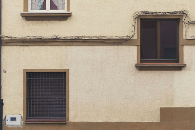 Low angle view of window on wall of building