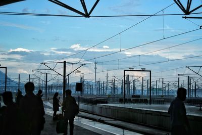 Silhouette of people in railway station