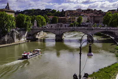 High angle view of boat by bridge over river