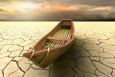 A drought with a boat on a dry lake