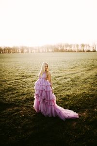 Beautiful woman sitting on a field