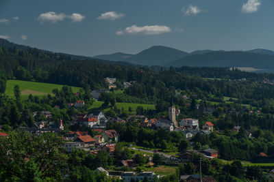 High angle view of townscape and mountains against sky