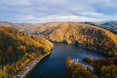 Autumn landscape with mountains and river, aerial top view