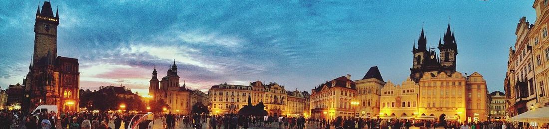 Panoramic view of crowd in old town against sky