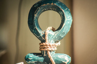 Close-up of rope tied to wooden souvenir