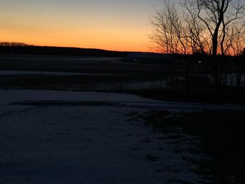 Scenic view of landscape at sunset