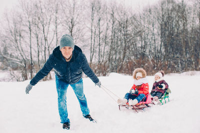 Man skiing on snow covered field