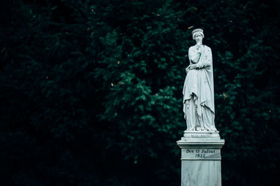 Low angle view of statue against sky