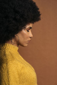 Close-up portrait of young woman looking away