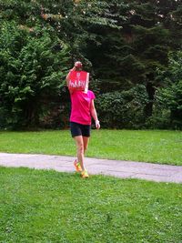 Rear view of woman standing in park