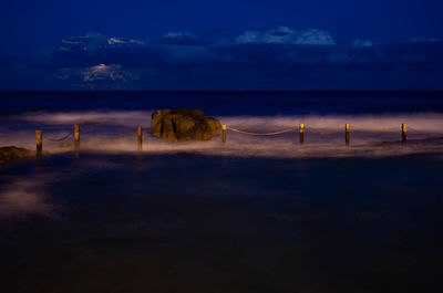 Scenic view of sea against sky at sunset