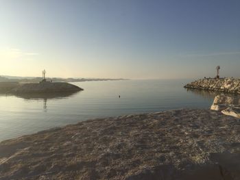 Scenic view of sea against sky at sunset