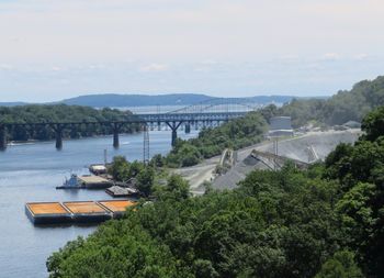 Bridge over river against sky