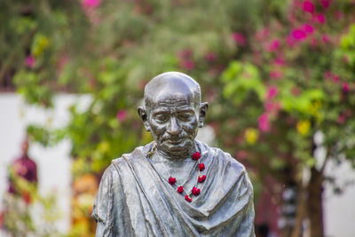 Close-up of statue against trees