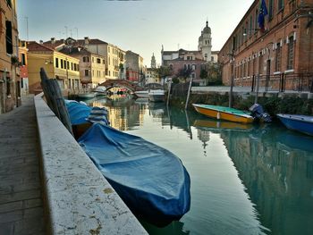 Boats moored in canal