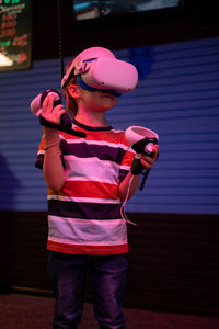 Vr game and virtual reality. kid boy gamer six years old fun playing on simulation video game