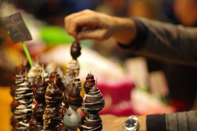 Close-up of man playing for sale in market