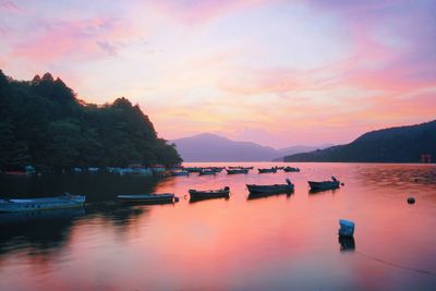 Scenic view of lake against sky during sunset