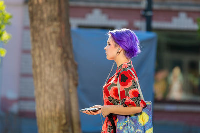 Side view of woman standing outdoors