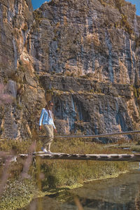 Young tourist walks on a path to the mountain. adventure travel, hiking concept.