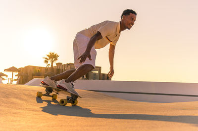 Low angle view of man standing on road