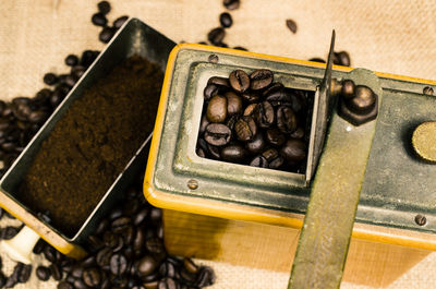 Close-up high angle view of coffee grinder on table