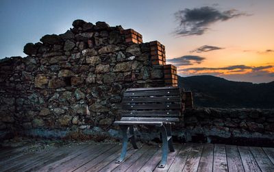 Stack of wood against sky