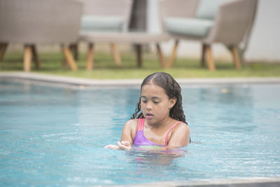 Woman swimming in pool