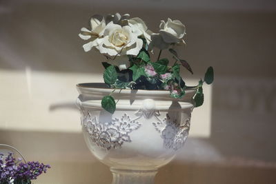 Close-up of flower vase on table