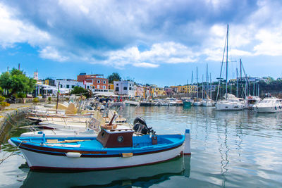 Boats moored at harbor