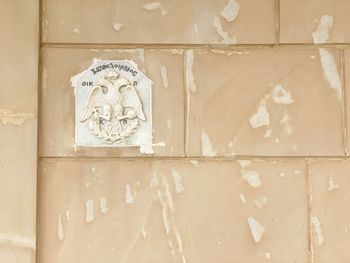 Close-up of text on wall