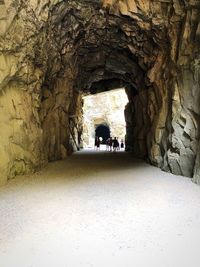 People walking in tunnel