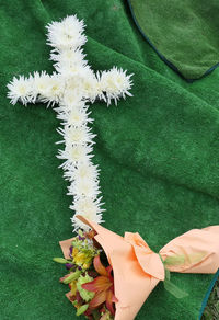 High angle view of flower bouquet on green textile