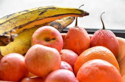 Close-up of apples in container