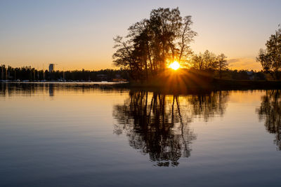 Scenic view of lake against sky during sunset