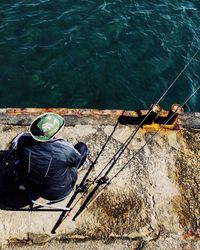 Rear view of man sitting in boat