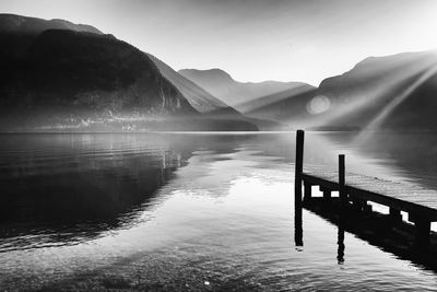 Pier over lake against sky