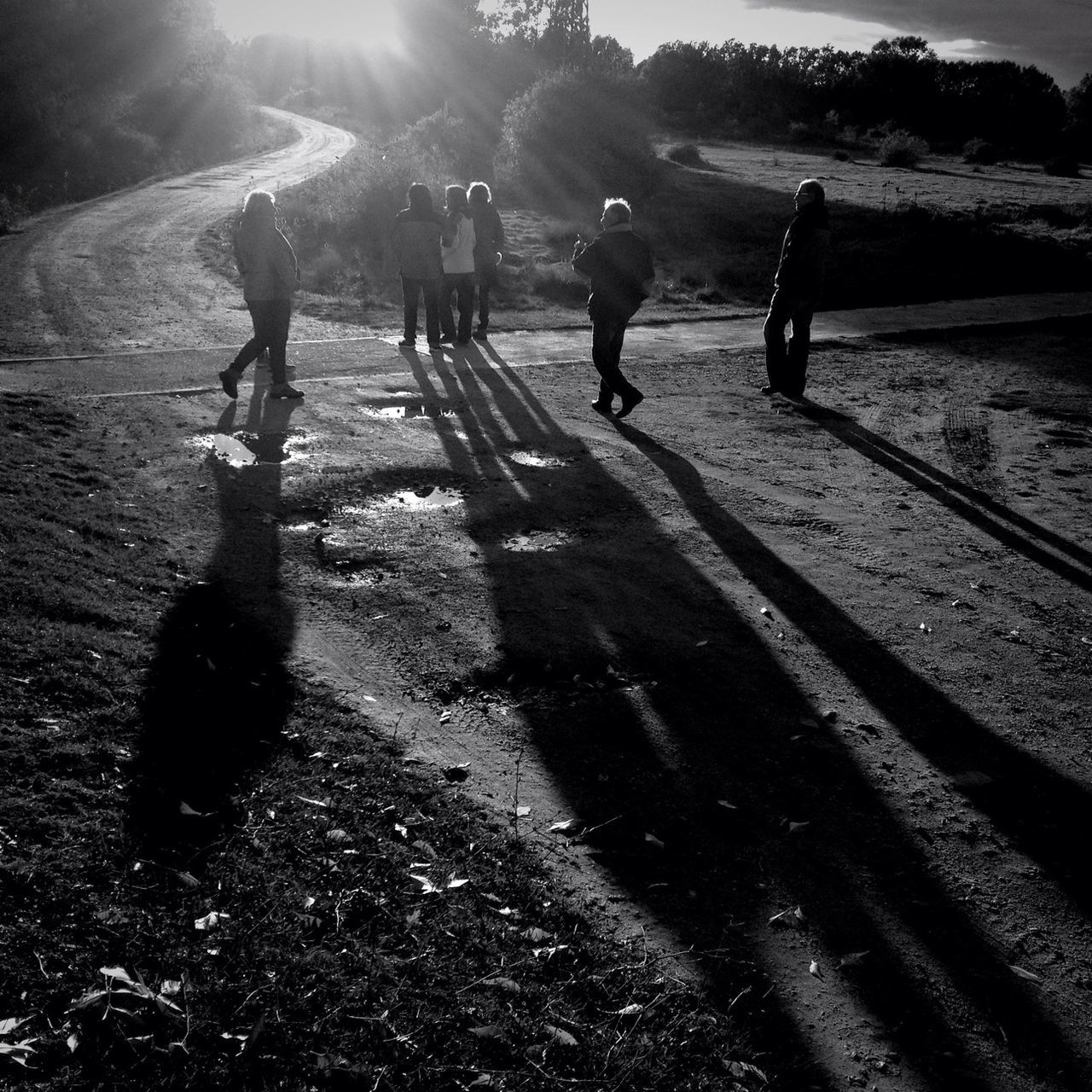 lifestyles, walking, shadow, leisure activity, full length, sunlight, men, person, street, togetherness, boys, sand, beach, sunny, silhouette, rear view, sun, childhood