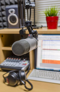 Close-up of microphone and computer keyboard