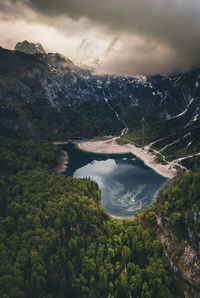 Scenic view of lake and mountains against sky