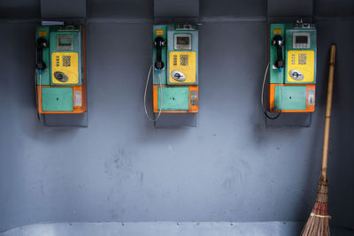 Close-up of telephone booth on wall