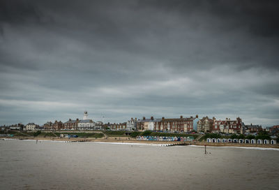 Scenic view of sea and buildings against sky