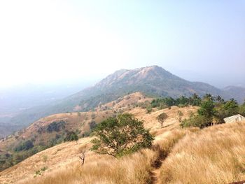 Scenic view of mountains in foggy weather