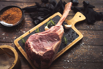 High angle view of meat on cutting board