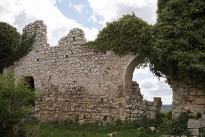 Old ruin building against cloudy sky